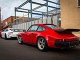 Red Porsche 911 wiith Whale-Tail on the street