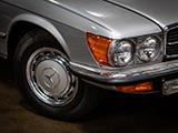Wheel and Headlight of Silver Mercedes-Benz SL