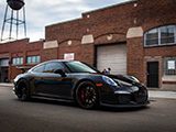 Black Porsche 911 GT3 at outside of Midwest Performance Cars in Chicago