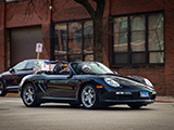 Black Porsche Boxster Hauling Christmas Gifts