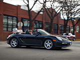 Black Porsche Boxster with Wrapped Christmas Gifts