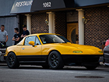 Yellow and Black Mazda Miata