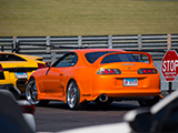 Orange Toyota Supra staging at Autobahn Country Club