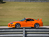 Orange mk4 Supra on the Track