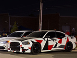 Red, white, and black graphics on Dodge Charger
