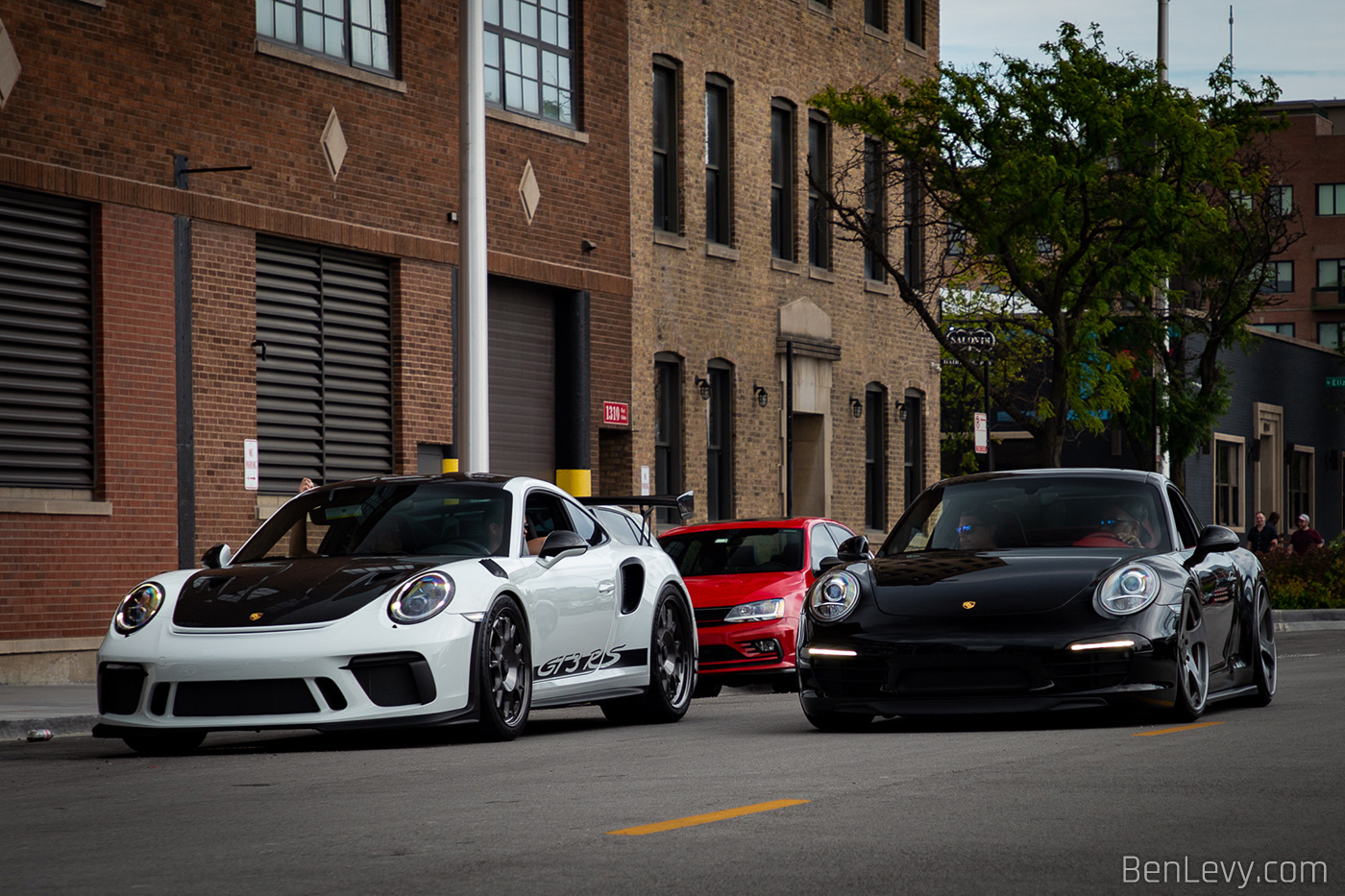 Porsche 911s on the street after Checkeditout