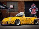 Yellow RWB 993 Cabriolet with the top down