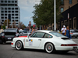 White Porsche 964 with Roads United Sticker