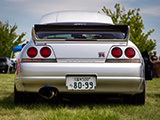 Rear Shot of Silver Nissan Skyline GT-R in the Grass