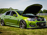 Green Chevrolet SS Sedan with Hood Open