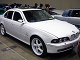 White BMW 5-Series with Armani Exchange Theme