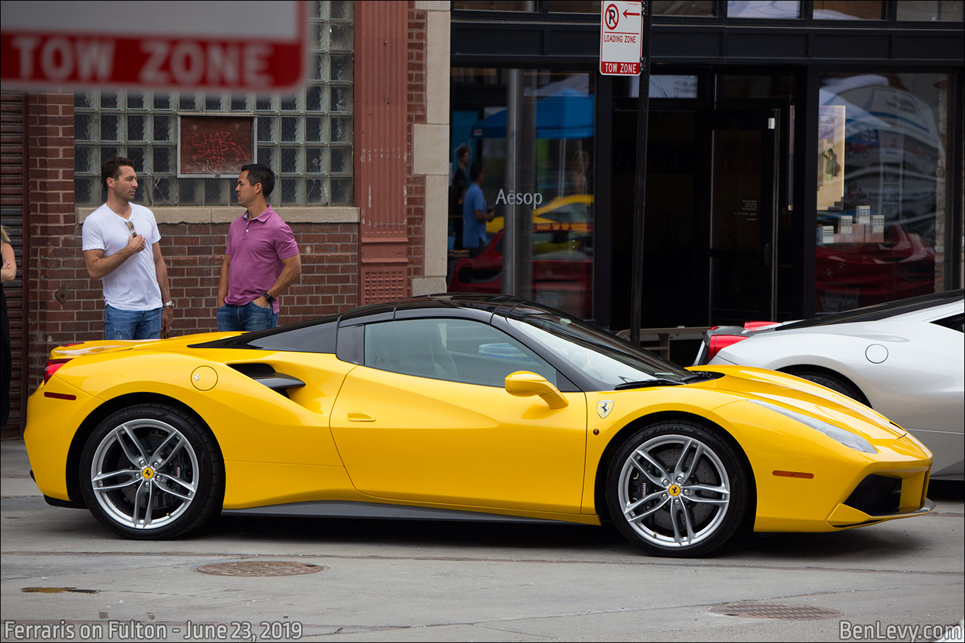 Yellow Ferrari 488 with black roof