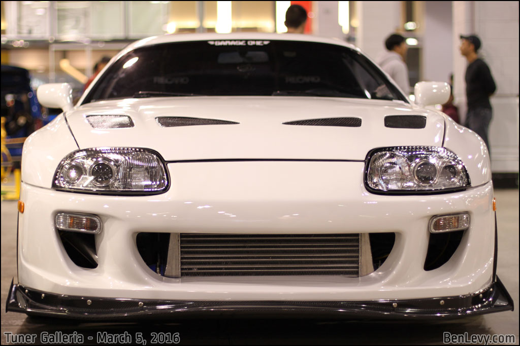 Front of White mkIV Toyota Supra with CF Lip