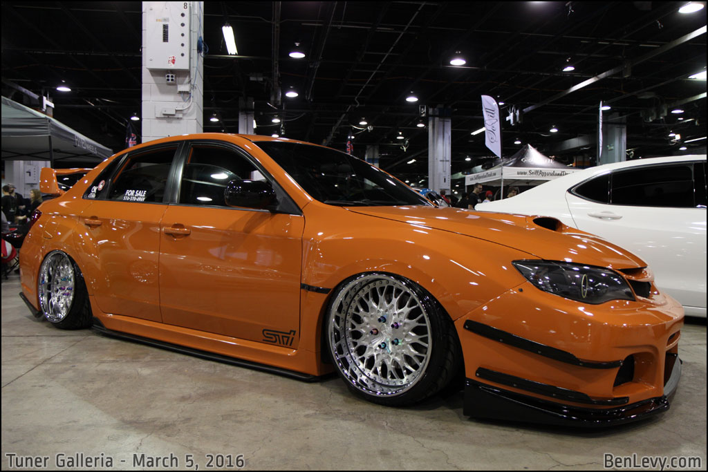 Orange Subaru WRX STI