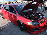 Red Mitsubishi Lancer Evolution tuned by R&D Performance