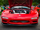 Front of Red Mazda RX-7 at Humboldt Park Car Show