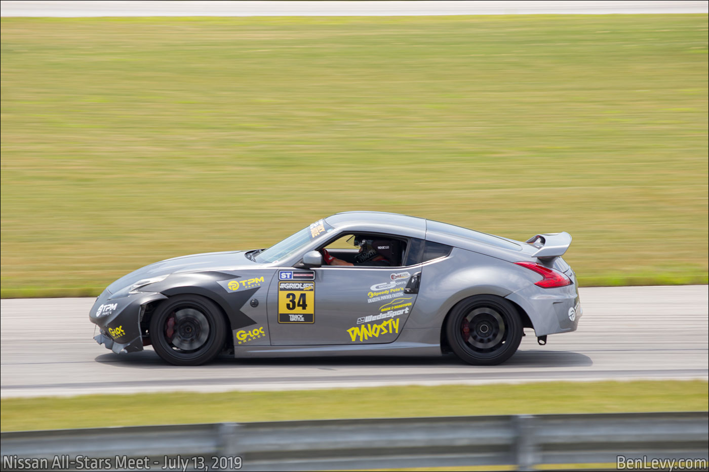 Silver Nissan 350Z on the track