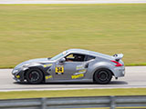 Silver Nissan 350Z on the track