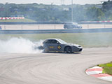 Smoking Tires wile Drifting a Grey S13 Nissan