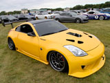 Yellow Nissan 350Z with Supercharger Poking Through the Hood