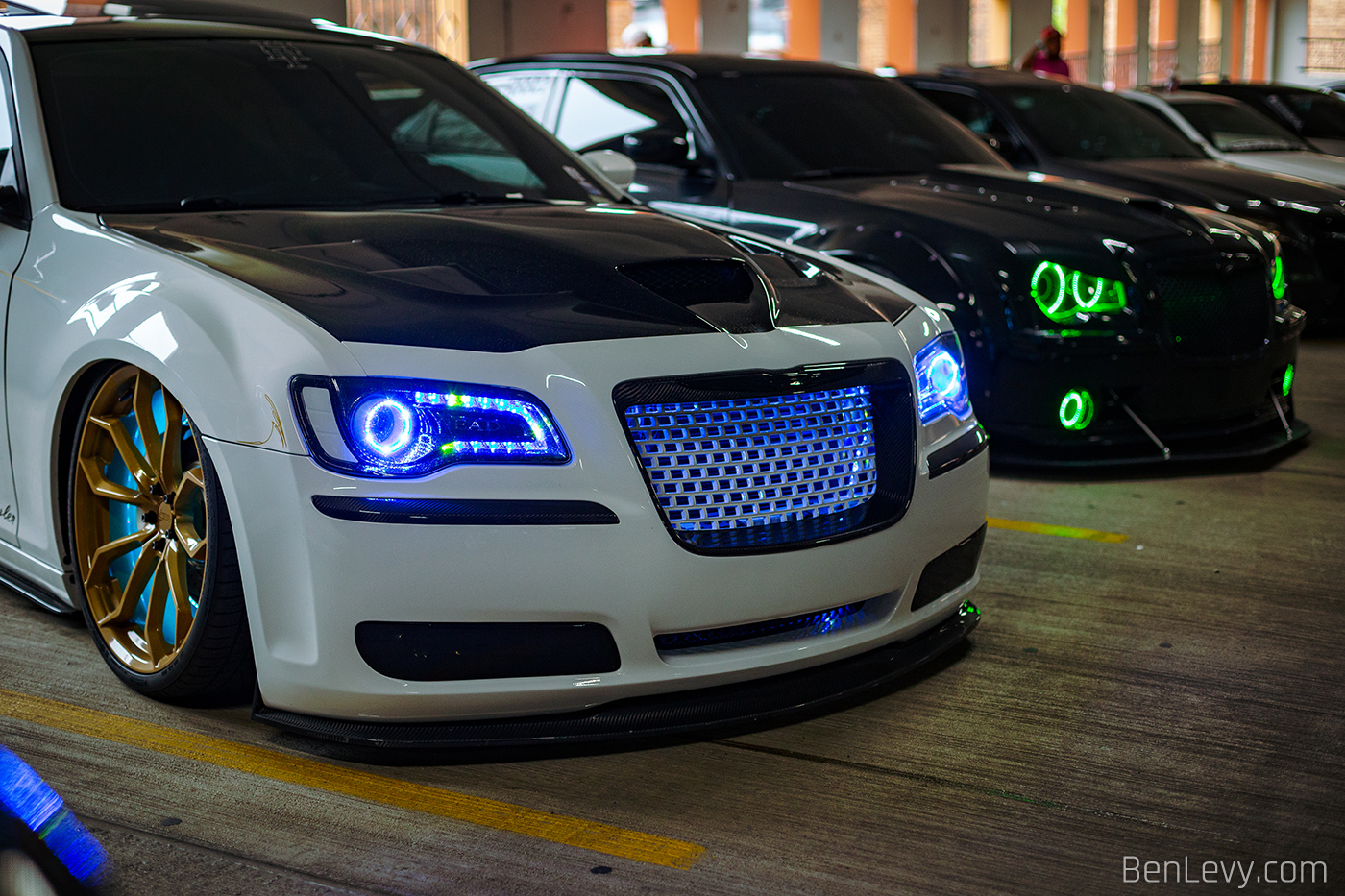 White Chrysler 300S with lights behind the grille