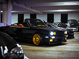 Black BMW E30 Convertible at the Parking Garage Party