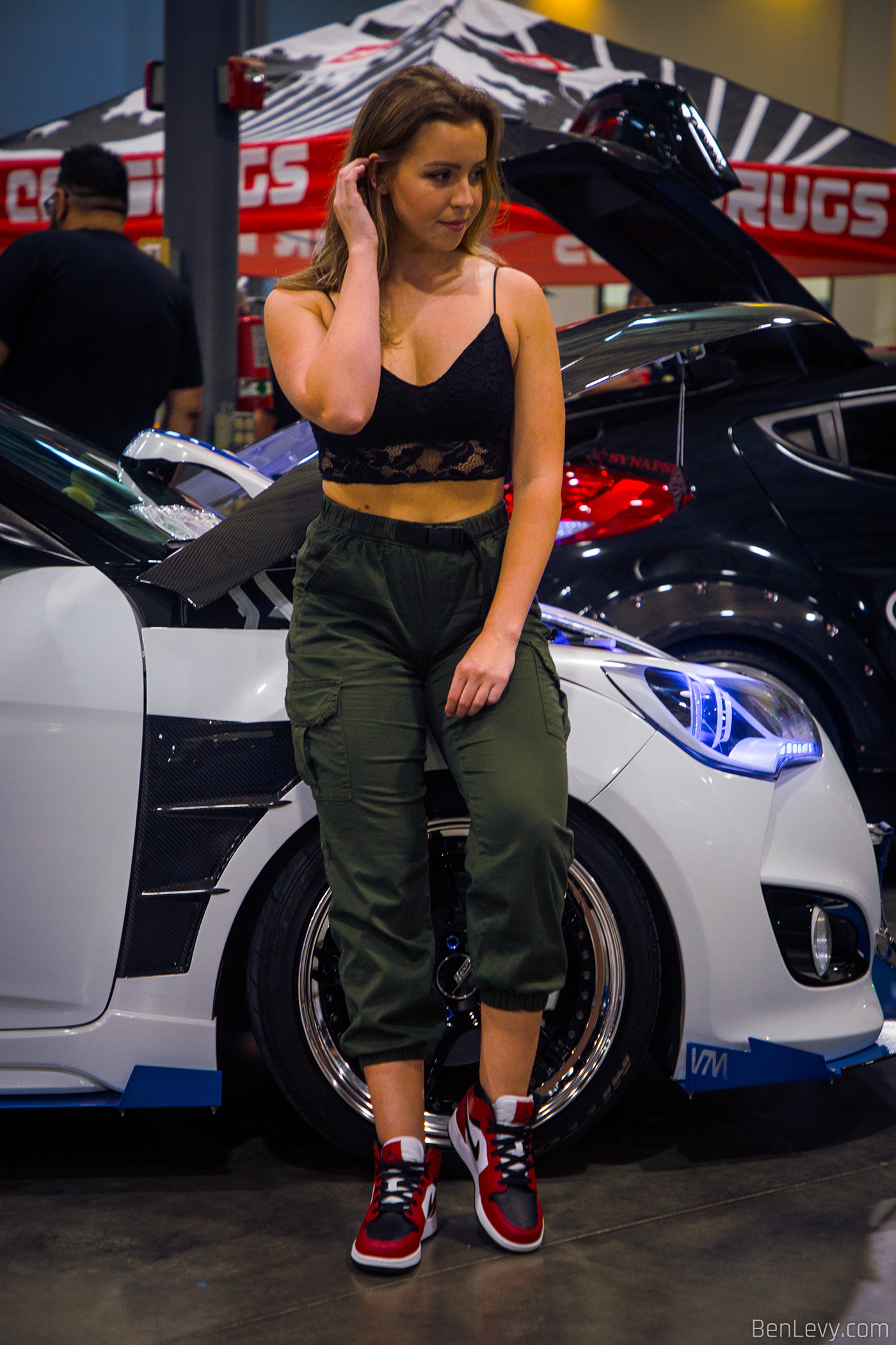 The Model Sarah with a Hyundai Veloster at Car Show