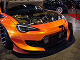 Orange Subaru BRZ with Hood Exit Exhaust