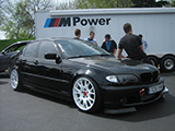 Black BMW 3-Series with carbon fiber hood