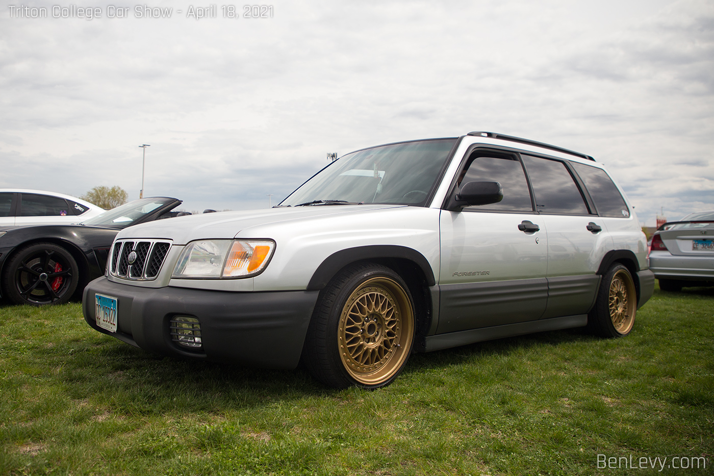 Silver Subaru Forester on Gold Wheels