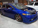 Blue Honda Civic Si sedan