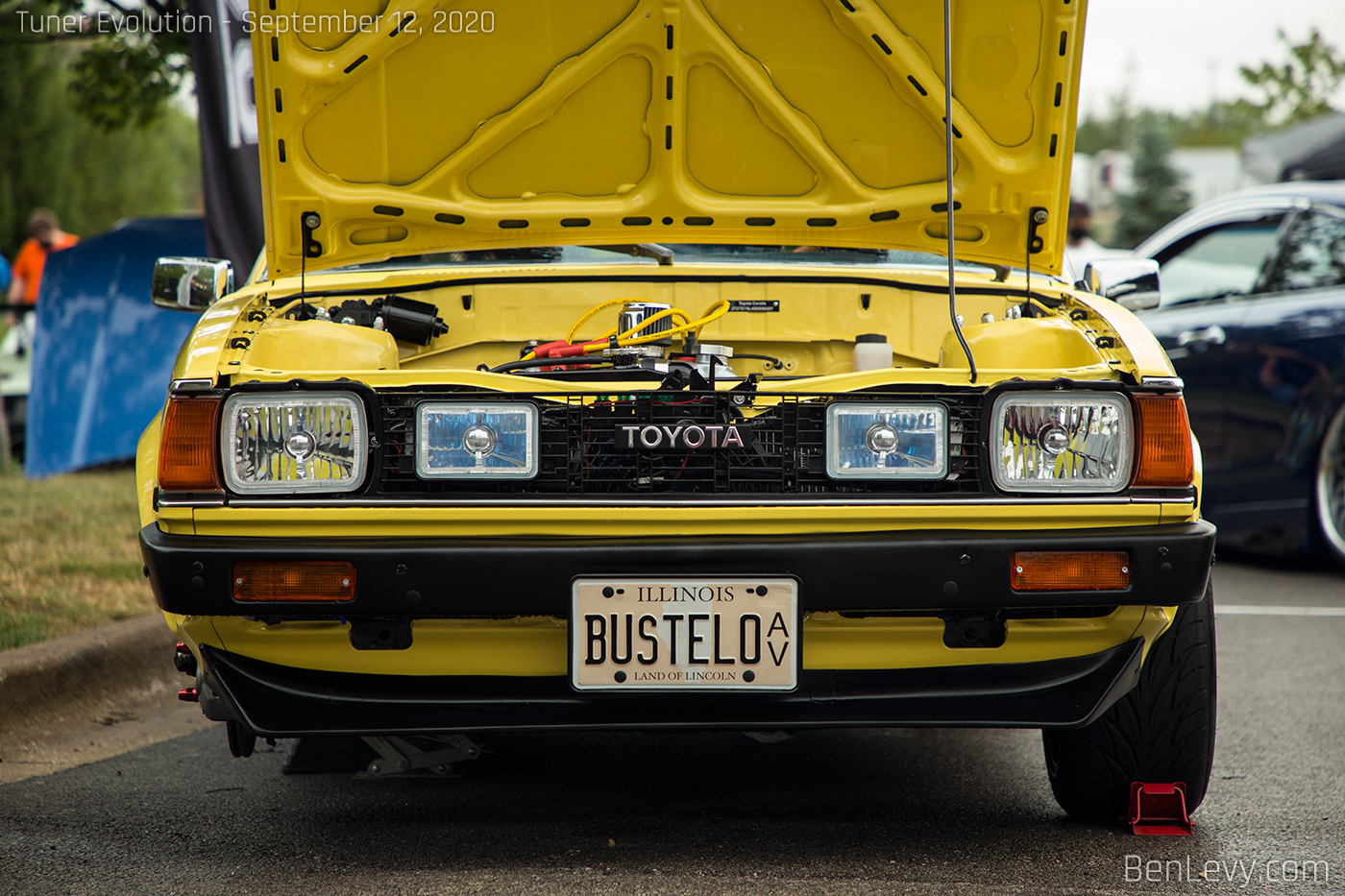 Headlights on a Yellow Toyota Corolla Liftback