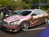 Nissan Maxima with pink reflective wrap