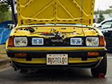 Headlights on a Yellow Toyota Corolla Liftback