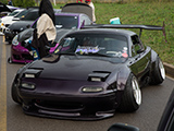 Purple Mazda Miata with wild camber