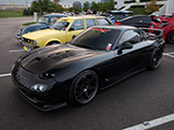 Black Mazda RX-7 with Uprise