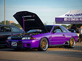 Purple Nissan Skyline GT-R at Omega Auto Service Booth at Tuner Evolution Chicago