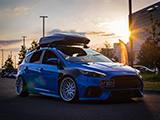 Blue Ford Focus RS with Rooftop Cargo