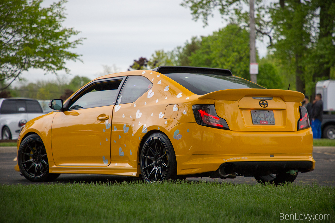 Yellow Scion tC with Heart Stickers