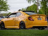 Yellow Scion tC with Heart Stickers