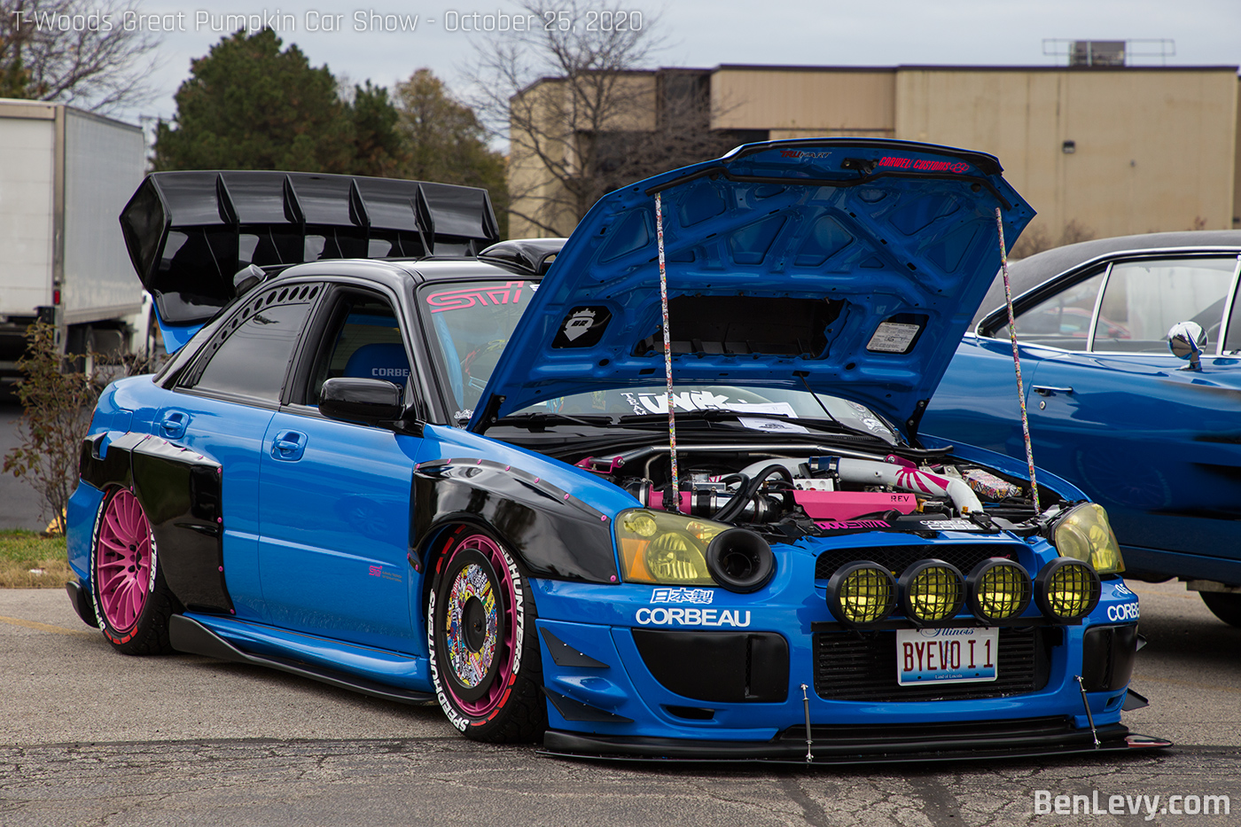 Blue Subaru WRX STI with rally lights