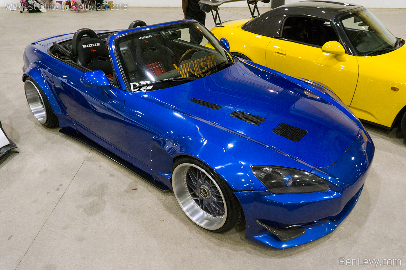 Blue Honda S2000 with vented hood and plaid seat inserts