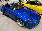 Blue Honda S2000 with vented hood and plaid seat inserts