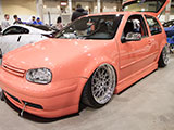 Peach-colored Volkswagen GTI
