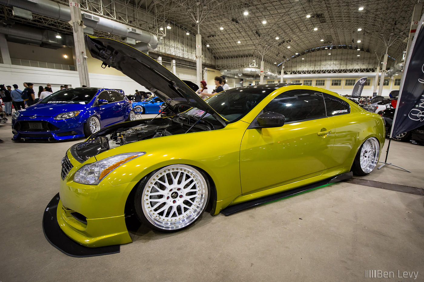 Yellow Infiniti G37s coupe with Royal Fitmment