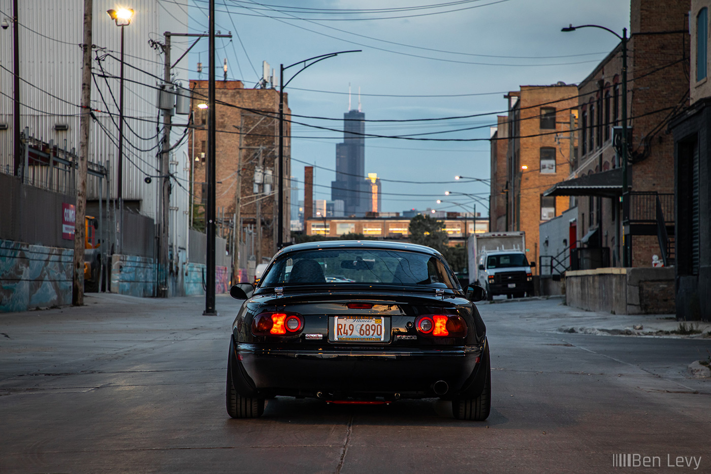 Rear of Black NA Miata with the Sears Tower in the Background
