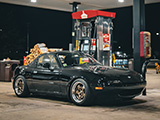 Black Mazda Miata at a Casey's Gas Station at Night