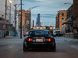Rear of Black NA Miata with the Sears Tower in the Background