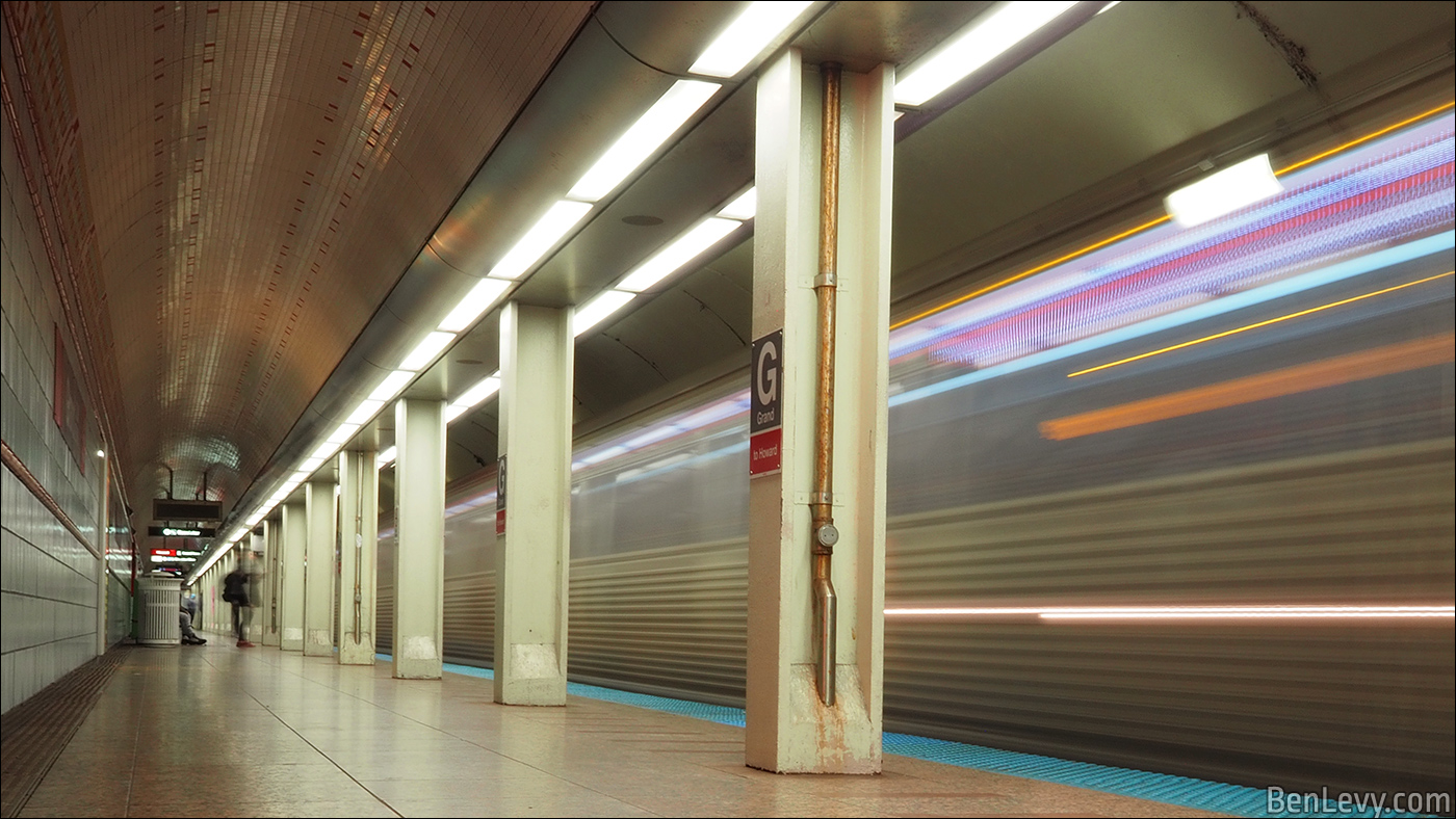 Red Line train arriving at Grand station