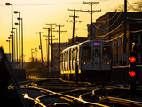 A golden sunset on the Pink Line tracks